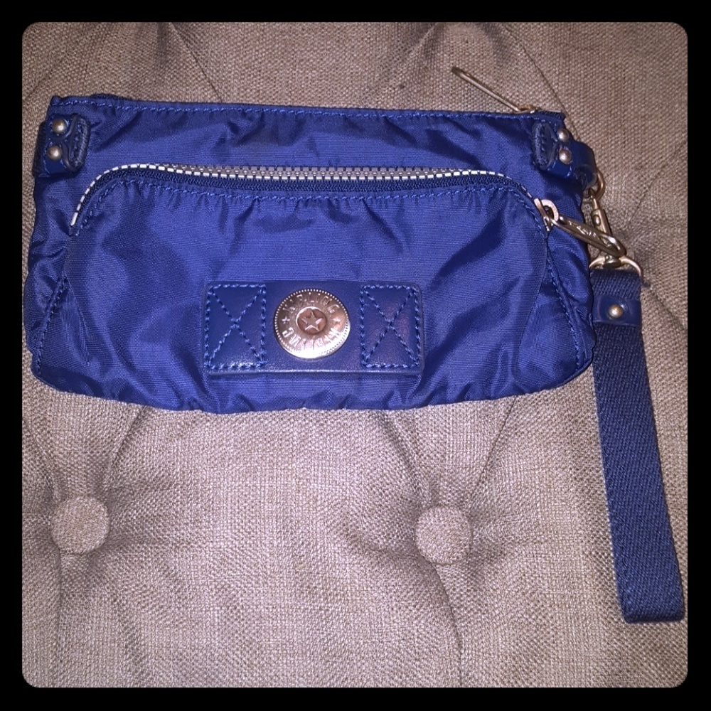 Kipling wristlet in dark blue with silver accents